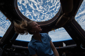 NASA astronaut Karen Nyberg, Expedition 37 flight engineer, enjoys the view of Earth from the windows in the Cupola of the International Space Station 