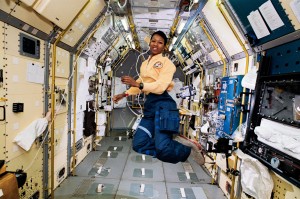 STS-47 Mission Specialist Mae Jemison appears to be clicking her heels in zero gravity in the center aisle of the Spacelab Japan (SLJ) science module aboard the Earth-orbiting Endeavour, Orbiter Vehicle (OV) 105. // NASA //