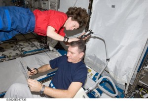 Interstellar haircut with astronauts Cady Coleman and Paolo Nespoli