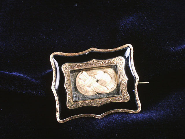 Photo of a 19th-century hair brooch, on display at the Childrens Museum of Indianapolis