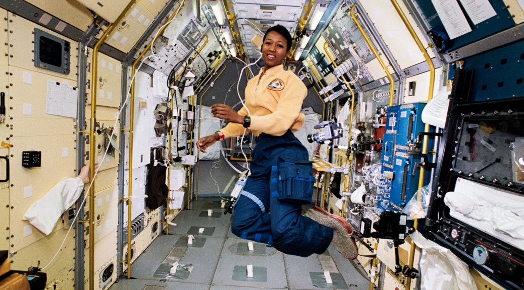 STS-47 Mission Specialist Mae Jemison appears to be clicking her heels in zero gravity in the center aisle of the Spacelab Japan (SLJ) science module aboard the Earth-orbiting Endeavour, Orbiter Vehicle (OV) 105. // NASA //