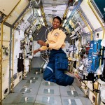 STS-47 Mission Specialist Mae Jemison appears to be clicking her heels in zero gravity in the center aisle of the Spacelab Japan (SLJ) science module aboard the Earth-orbiting Endeavour, Orbiter Vehicle (OV) 105. // NASA //